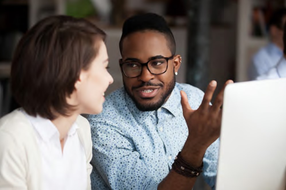 Image of two people chatting 