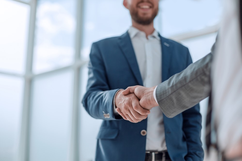 Image of two men shaking hands