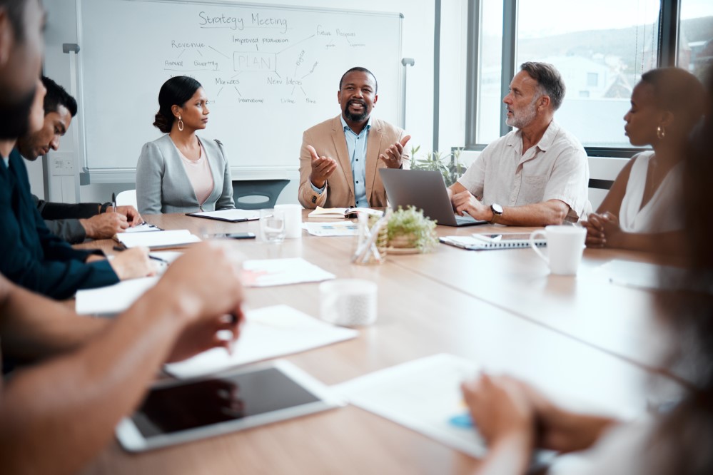 Image of staff at a conference table