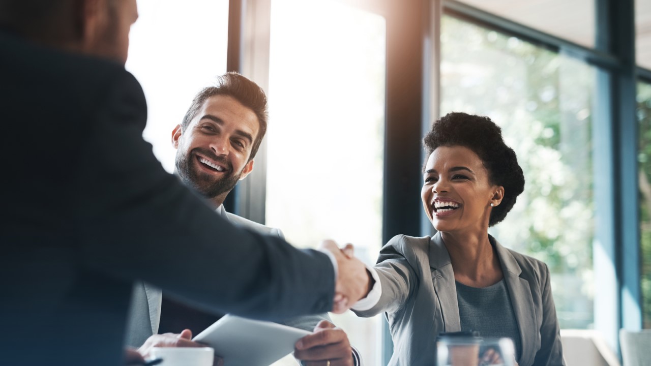 Stock image of people shaking hands