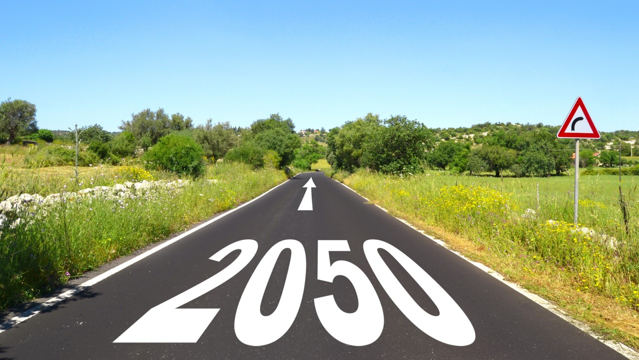 Image of a road with "2050" painted on it