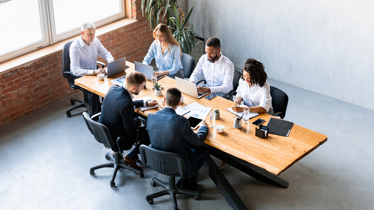 Image of team at conference room table