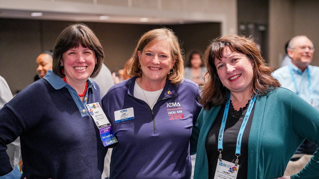 Photo of Julia Novak and conference goers