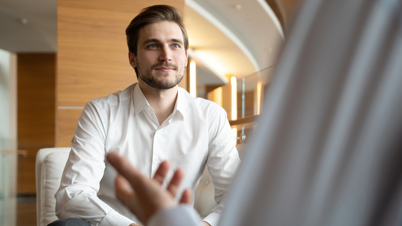 Image of two people talking