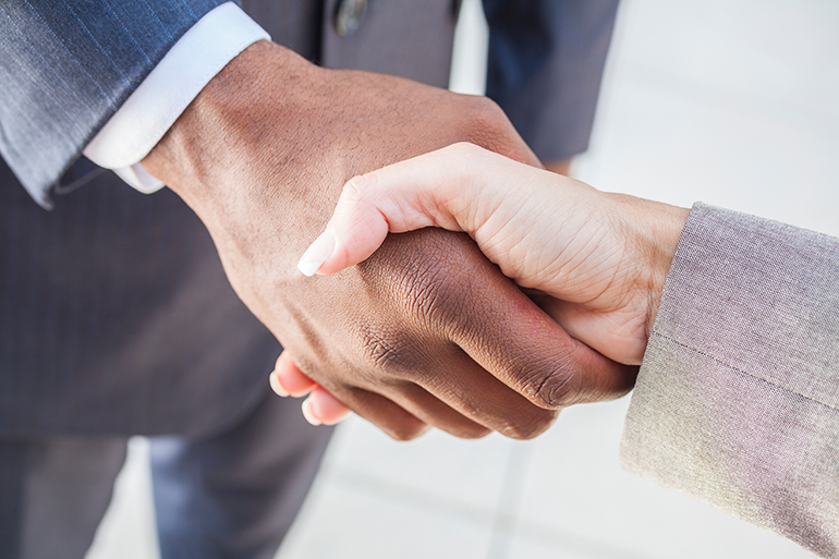 Photo of a man & woman shaking hands