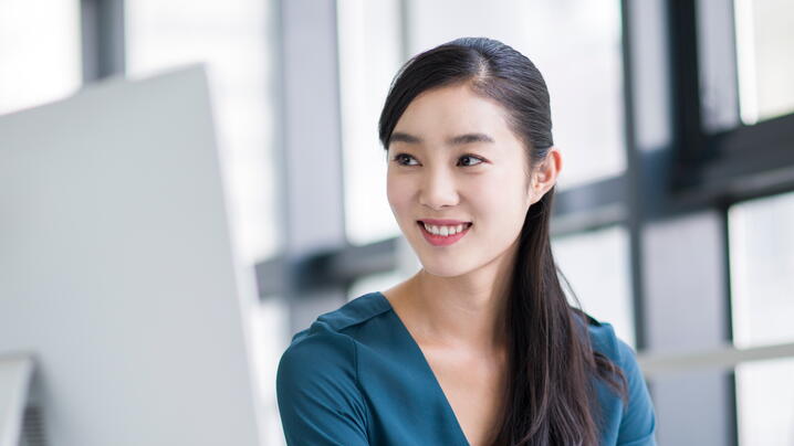 Young Chinese businesswoman working in office