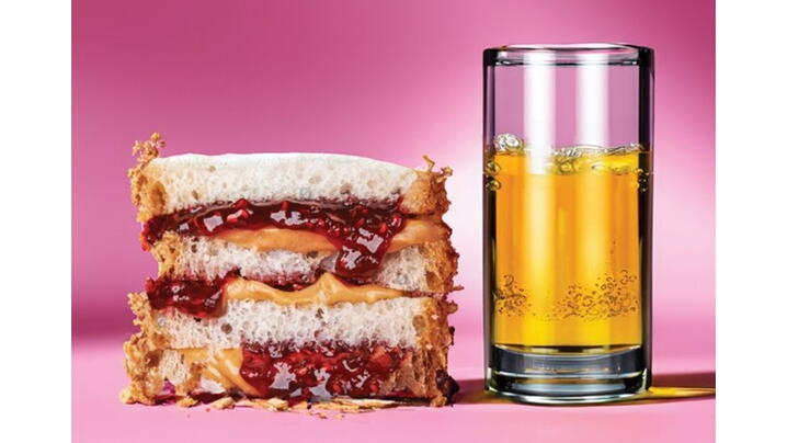 Image of a peanut butter and jelly sandwich and a glass of oil and water