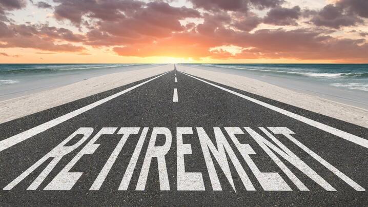 Image of road with "retirement" painted on it