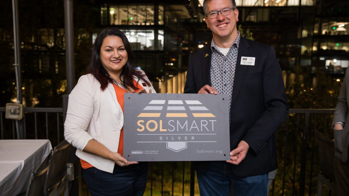 Hopkins, MN receiving their SolSmart Silver designation plaque.