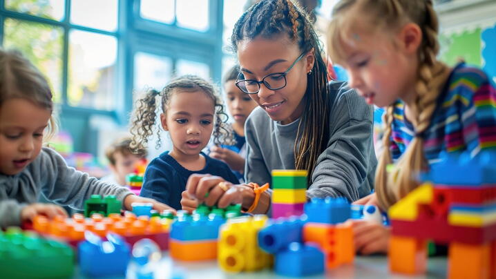 Image of person playing with children