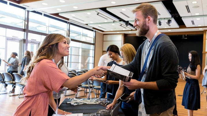 Image of two people shaking hands