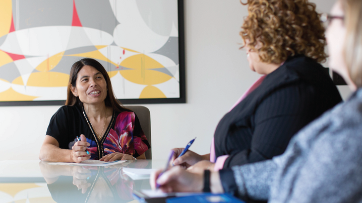 women around meeting table