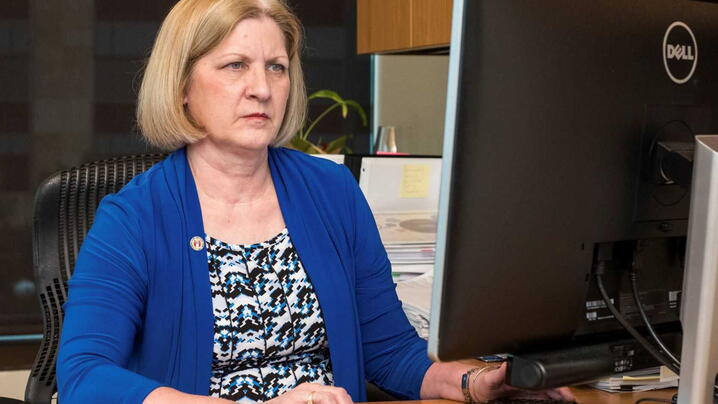 Austin city staff member studying computer screen