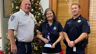 Photo of three Indian Creek employees accepting the award on the recipient's behalf