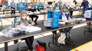 Local government employees in Bruges working on mask distribution