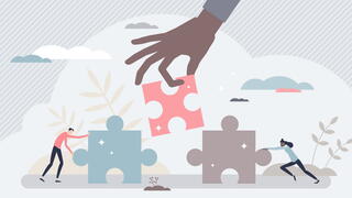 vector graphic with people fitting jigsaw puzzle pieces together to demonstrate collaboration, teamwork and work support for problem solving