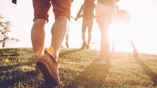 People walking up a hill