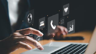 Image of person typing on laptop
