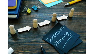 Image of a post-it that says Succession Planning