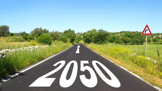 Image of a road with "2050" painted on it
