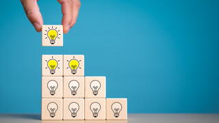 An image of building blocks with lightbulbs on them