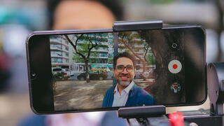 Image of person filming themselves on smartphone