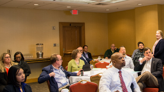 men and women in meeting room