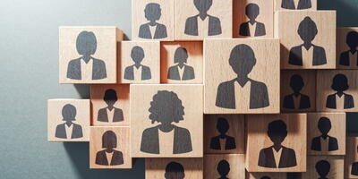 Image of blocks with silhouetted heads on them