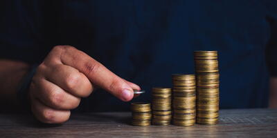 Man stacking coins