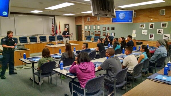 kids sit in class taught by police