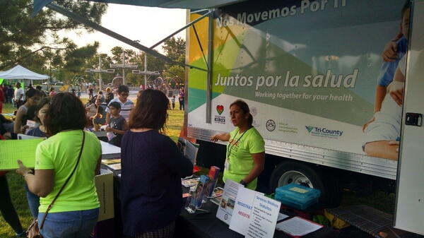 Women giving directions at booth